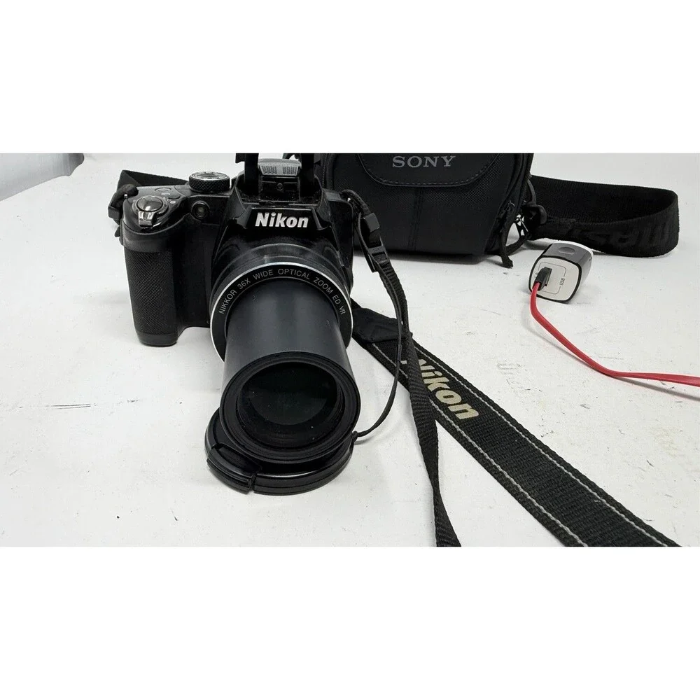 Nikon COOLPIX P500 36X Zoom 12.1MP Tilt Screen Digital Camera - Bundle - Nice